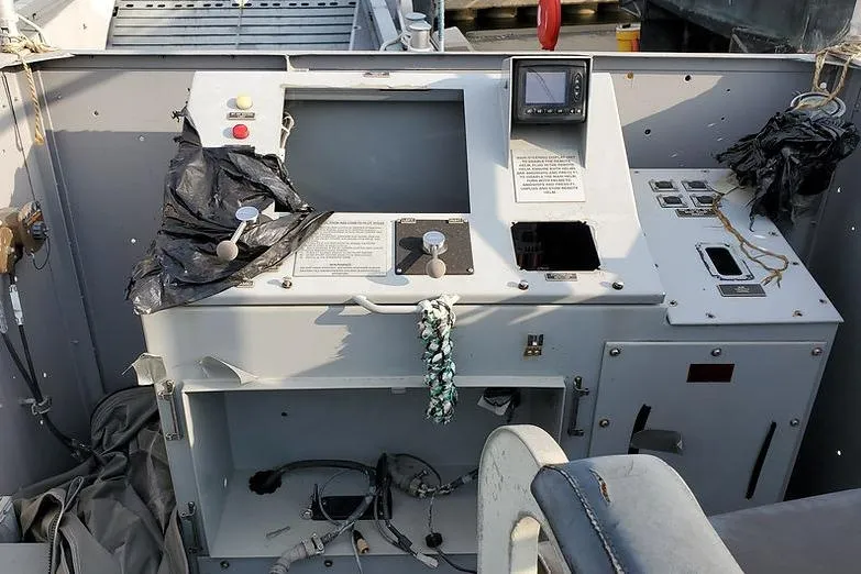Slide: The Image of Control panel of a 1970 COMMERICAL BOAT LCU-135, featuring navigation equipment and controls. - 7