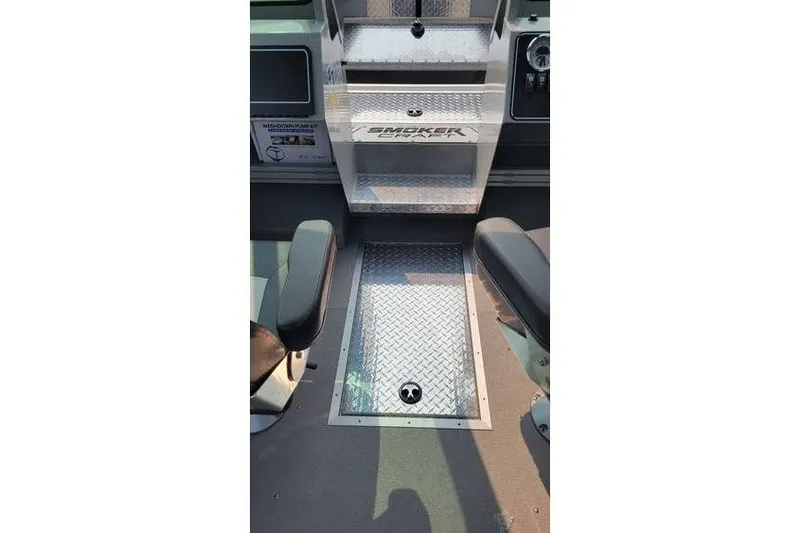 Slide: The Image of Interior of 2026 Smoker Craft Phantom 18 X2 boat, featuring diamond plate flooring. - 11