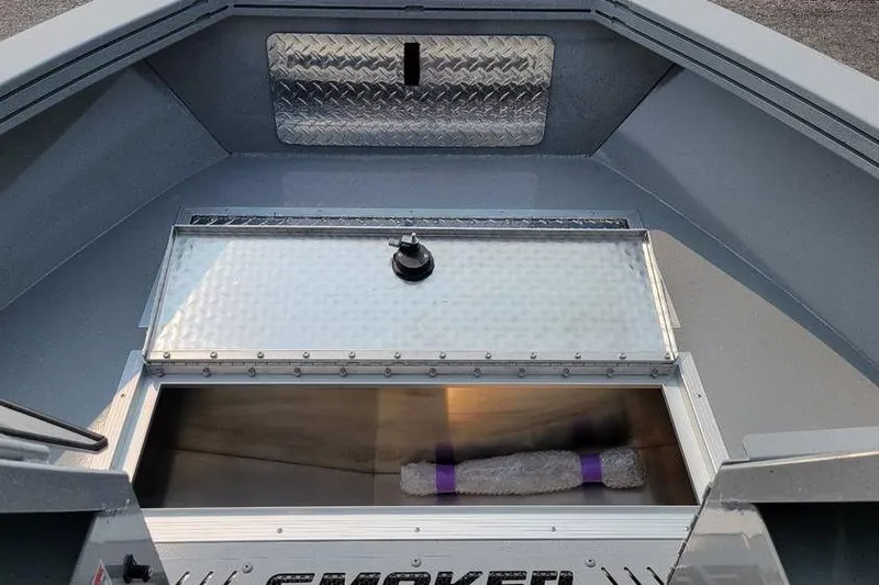 Slide: The Image of 2026 Smoker Craft Phantom 18 X2 boat interior with storage compartment and metallic finish. - 14