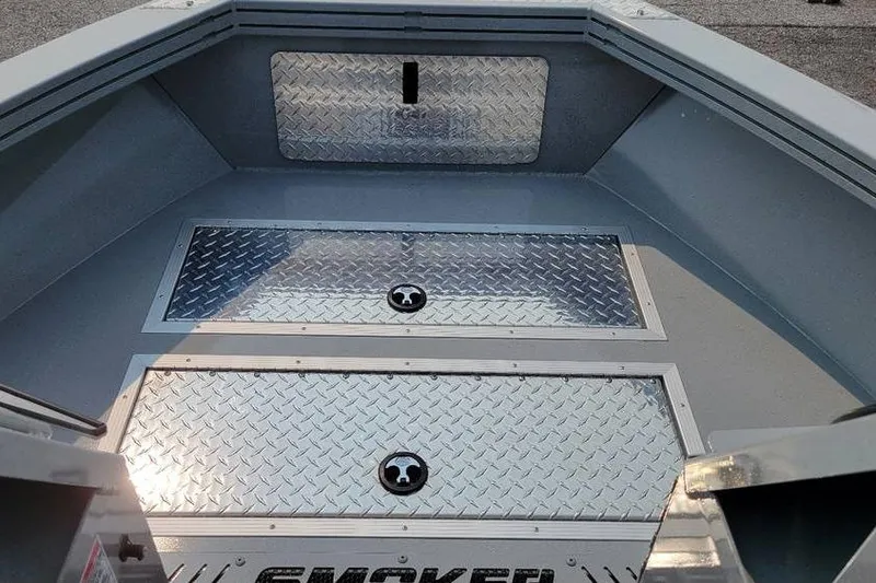 Slide: The Image of 2026 Smoker Craft Phantom 18 X2 boat interior with diamond plate flooring. - 15