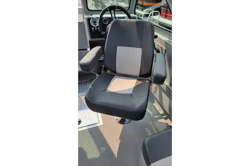 Slide: The Image of Captain's chair in 2026 Smoker Craft Phantom 18 X2 boat interior. - 21