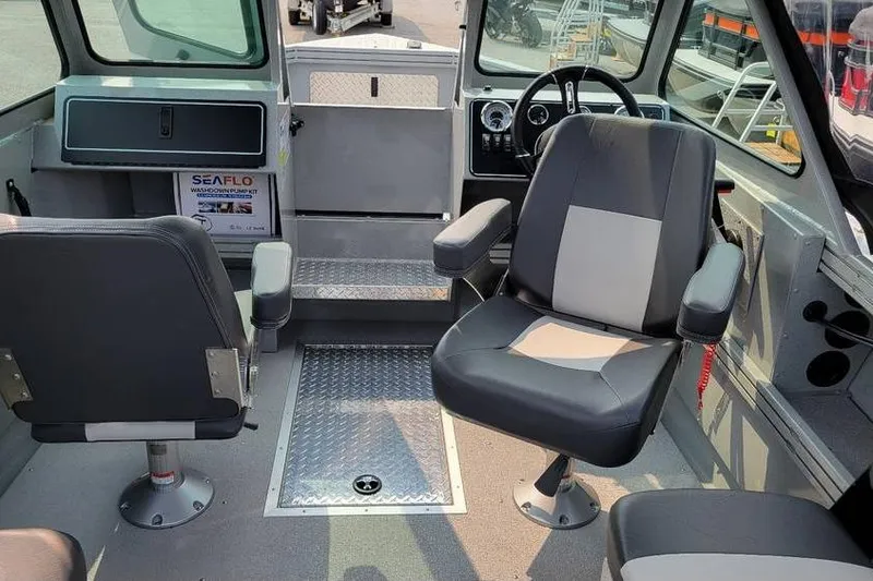 Slide: The Image of Interior of 2026 Smoker Craft Phantom 18 X2 boat with seating and steering wheel. - 22