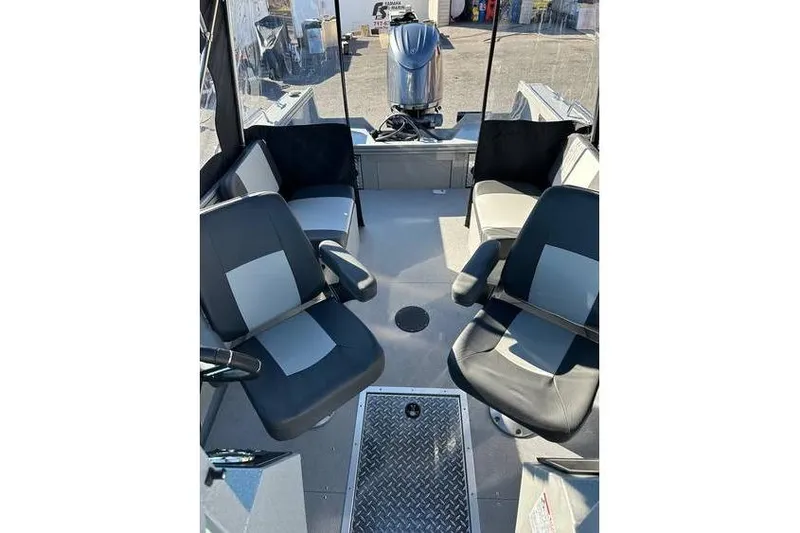 Slide: The Image of 2026 Smoker Craft Phantom 18 X2 interior with seating and Yamaha 150 hp engine. - 6