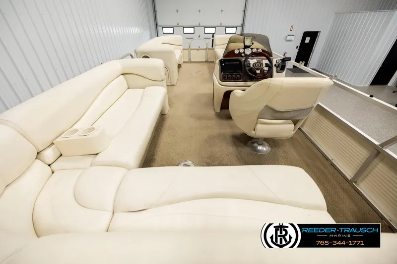 Slide: The Image of 2006 Sun Tracker Party Barge 22 Regency Edition interior with plush seating and helm. - 15