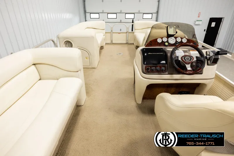 Slide: The Image of 2006 Sun Tracker Party Barge 22 Regency Edition interior with plush seating and control console. - 16