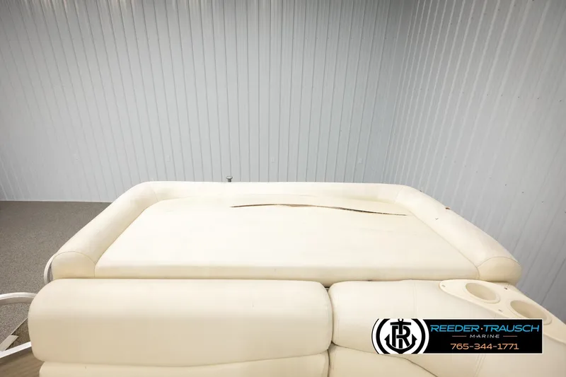 Slide: The Image of 2006 Sun Tracker Party Barge 22 Regency Edition with beige seating and cup holders. - 22