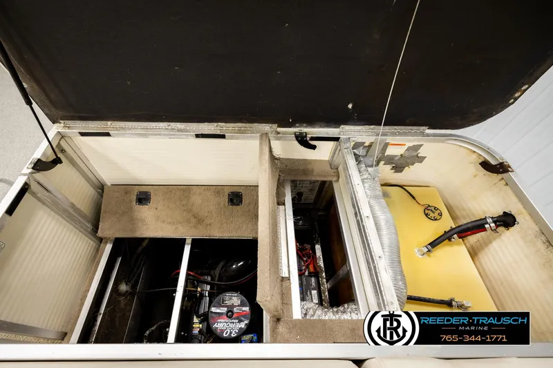 Slide: The Image of 2006 Sun Tracker Party Barge 22 Regency Edition interior storage and engine compartment. - 24