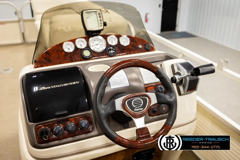 Slide: The Image of 2006 Sun Tracker Party Barge 22 Regency Edition dashboard with steering wheel and controls. - 27