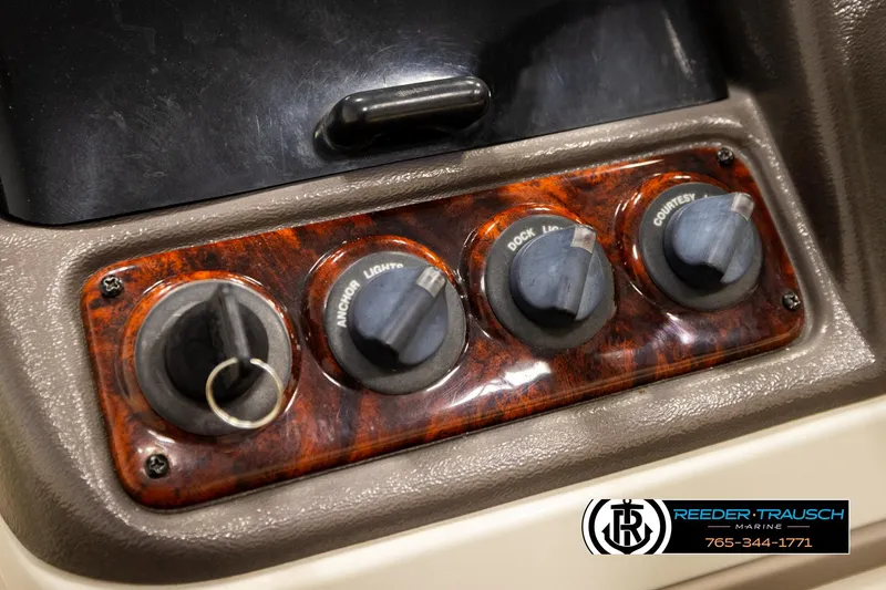 Slide: The Image of Control panel of 2006 Sun Tracker Party Barge 22 Regency Edition with labeled switches. - 29