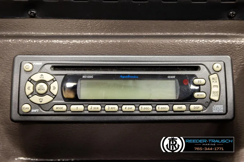 Slide: The Image of 2006 Sun Tracker Party Barge 22 Regency Edition stereo system with control buttons and display. - 30