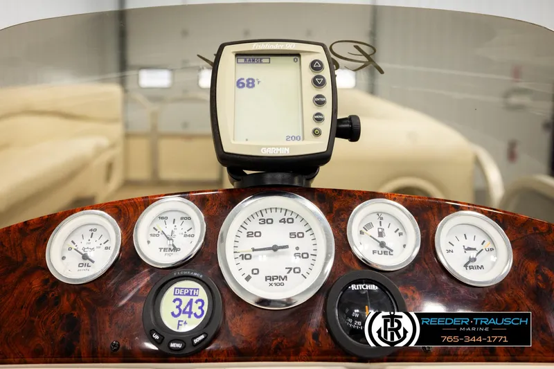 Slide: The Image of Dashboard of 2006 Sun Tracker Party Barge 22 Regency Edition with gauges and Garmin device. - 31