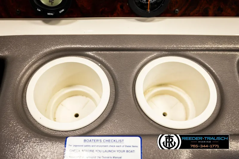 Slide: The Image of 2006 Sun Tracker Party Barge 22 Regency Edition cup holders and control panel detail. - 32