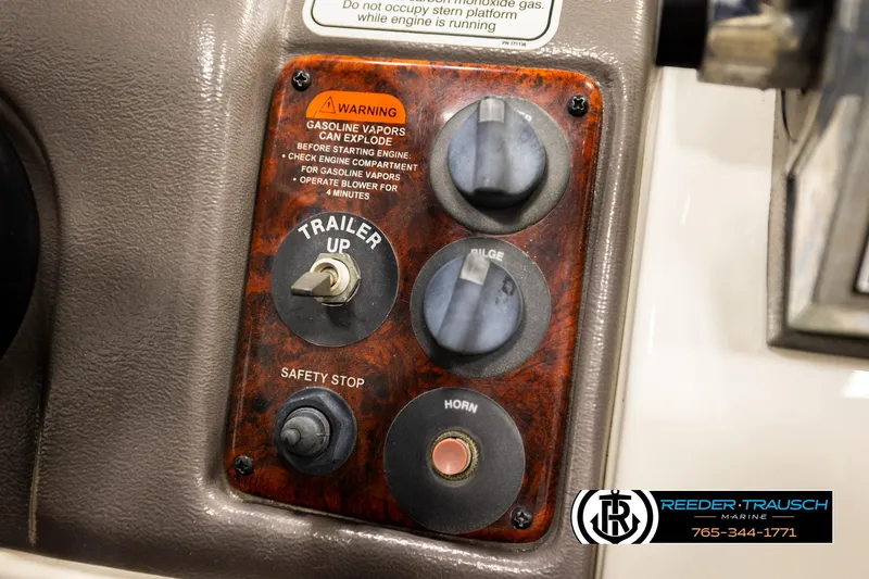 Slide: The Image of 2006 Sun Tracker Party Barge 22 Regency Edition control panel with warning labels and switches. - 33