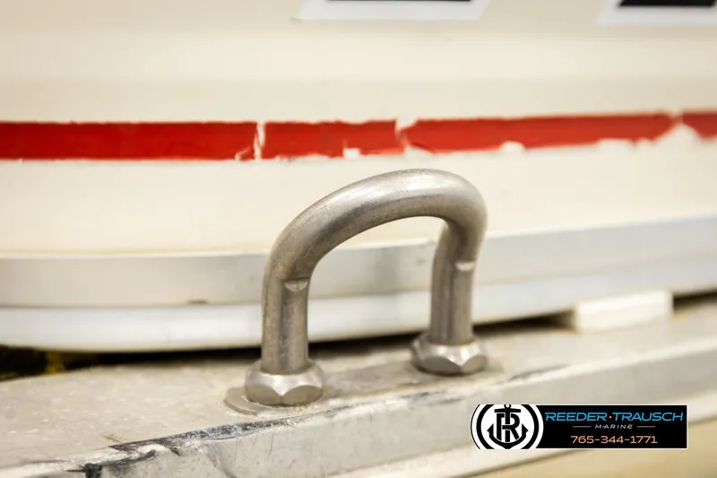 Slide: The Image of Close-up of 2006 Sun Tracker Party Barge 22 Regency Edition boat detail with metal cleat. - 47