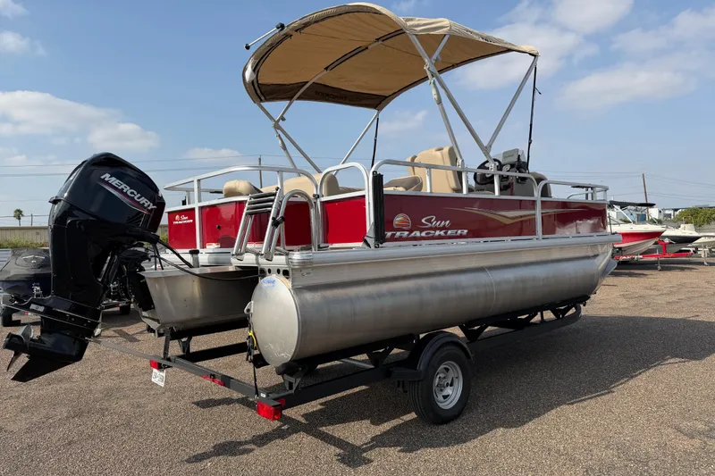 Slide: The Image of 2025 Sun Tracker Bass Buggy 18 DLX pontoon boat with Mercury outboard motor. - 87