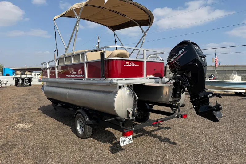 Slide: The Image of 2025 Sun Tracker Bass Buggy 18 DLX pontoon boat with Mercury outboard motor. - 89