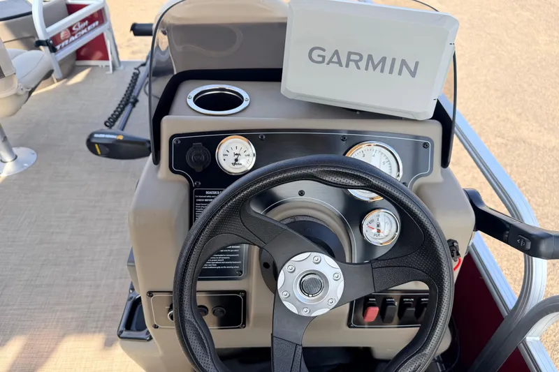 Slide: The Image of Steering console of 2025 Sun Tracker Bass Buggy 18 DLX with Garmin navigation system. - 91