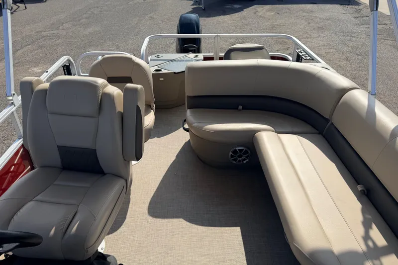 Slide: The Image of 2025 Sun Tracker Bass Buggy 18 DLX pontoon boat interior with beige seating. - 93