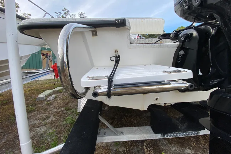 Slide: The Image of 2006 Mako 191 Inshore boat stern with motor and swim platform. - 11