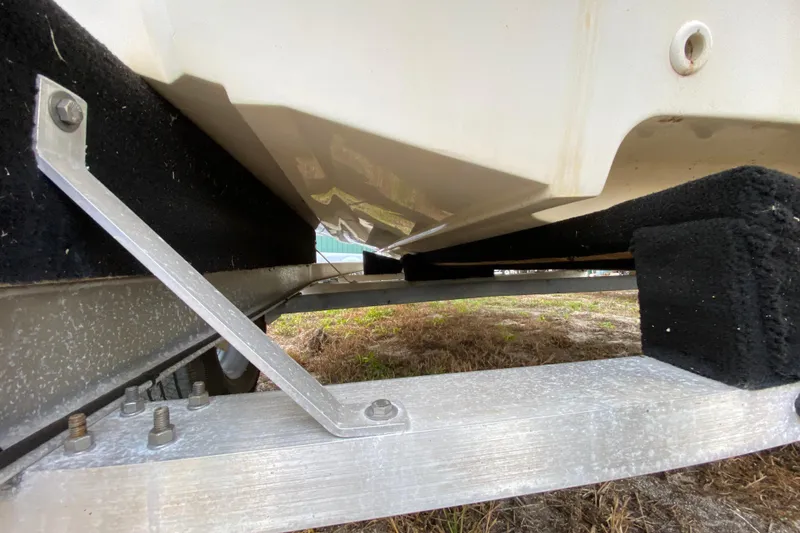 Slide: The Image of Trailer support for 2006 Mako 191 Inshore boat, showing hull and brackets. - 12