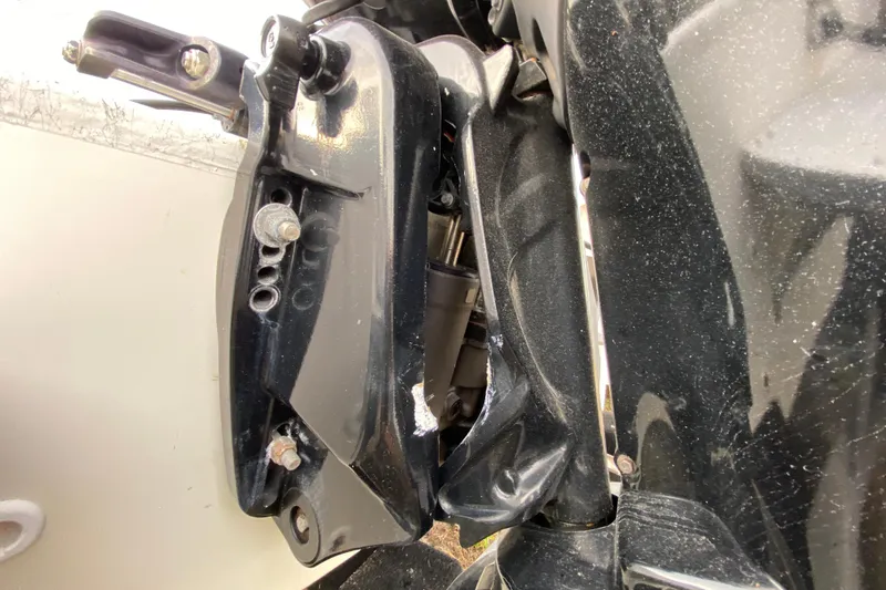 Slide: The Image of Close-up of a 2006 Mako 191 Inshore boat motor mount, showing mechanical details. - 14