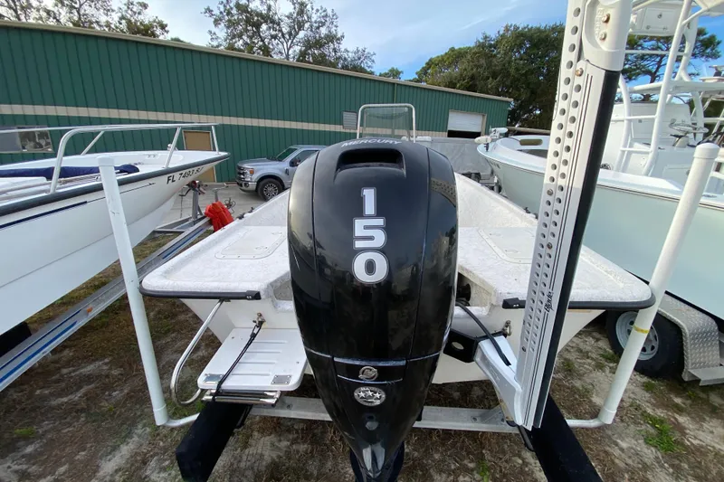 Slide: The Image of 2006 Mako 191 Inshore boat with a 150 horsepower Mercury outboard engine. - 19