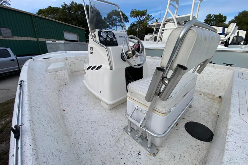 Slide: The Image of 2006 Mako 191 Inshore boat interior with steering console and seating. - 24