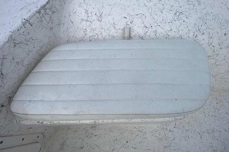 Slide: The Image of White cushioned seat on a 2006 Mako 191 Inshore boat. - 32