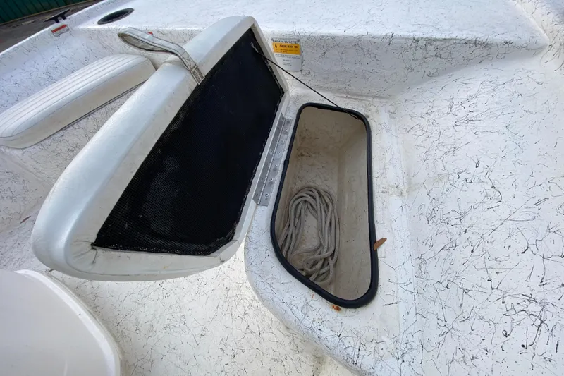 Slide: The Image of 2006 Mako 191 Inshore boat storage compartment with rope inside. - 33