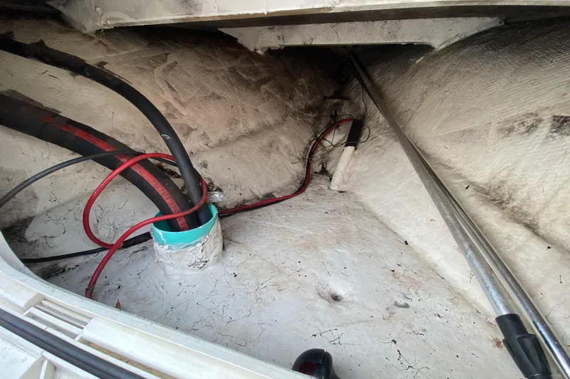 Slide: The Image of Interior view of a 2006 Mako 191 Inshore boat showing wiring and structural details. - 35