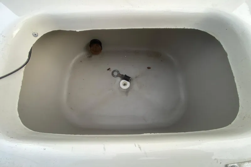 Slide: The Image of Empty storage compartment in a 2006 Mako 191 Inshore boat. - 39