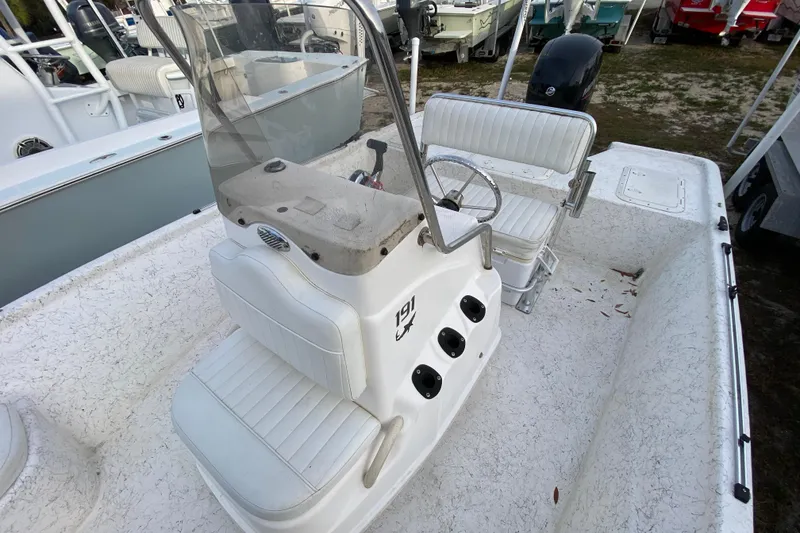 Slide: The Image of 2006 Mako 191 Inshore boat interior with steering console and seating. - 41