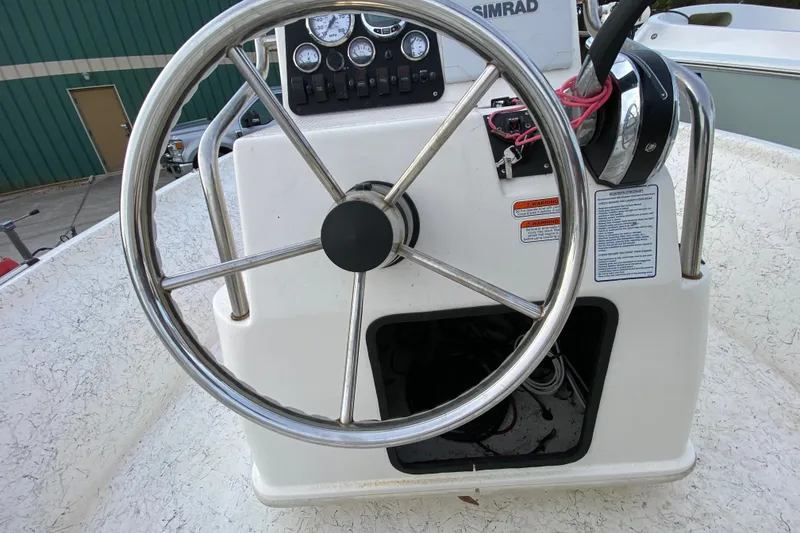 Slide: The Image of Steering console of 2006 Mako 191 Inshore boat with gauges and controls. - 47