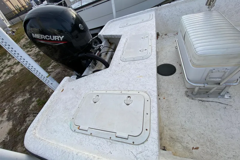 Slide: The Image of 2006 Mako 191 Inshore boat deck with Mercury outboard motor. - 54