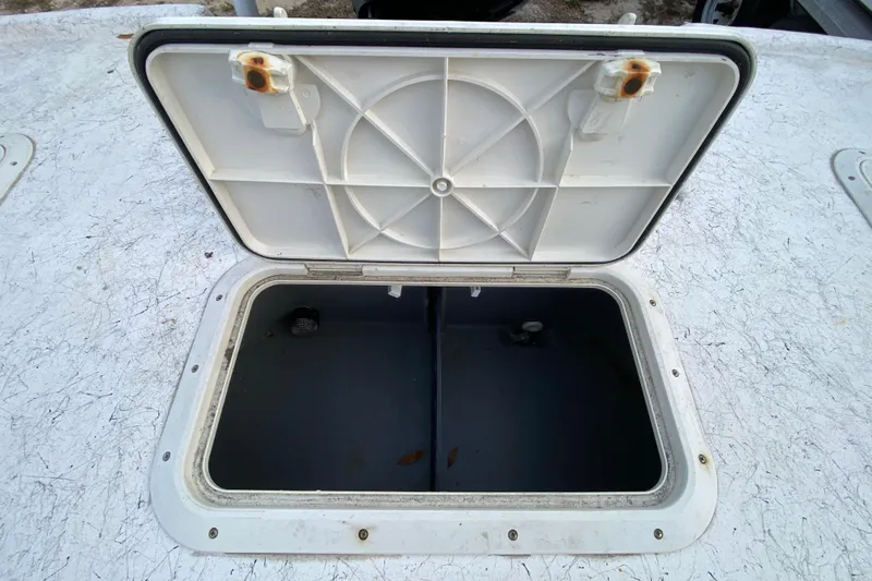 Slide: The Image of Open storage hatch on 2006 Mako 191 Inshore boat deck. - 59
