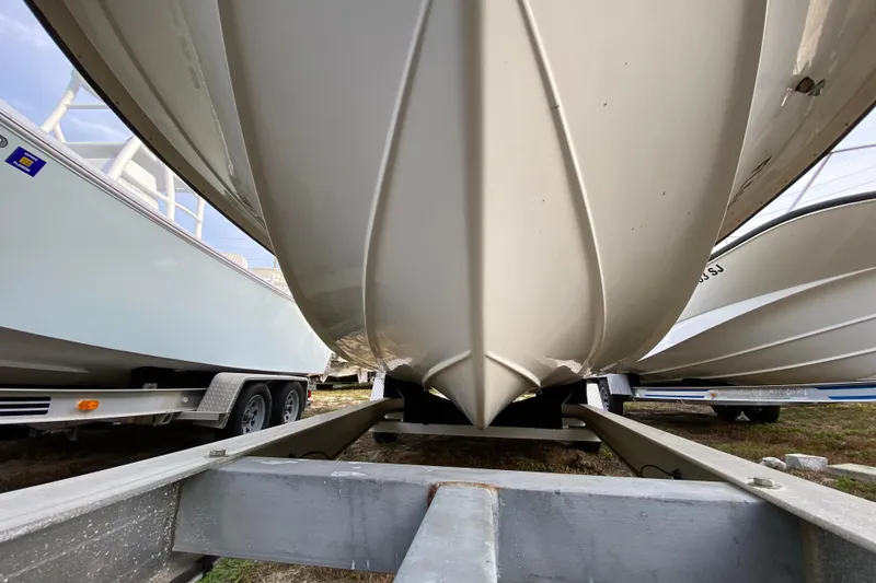 Slide: The Image of 2006 Mako 191 Inshore boat on trailer, viewed from below, showcasing hull design. - 6