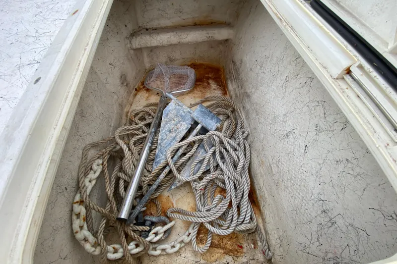 Slide: The Image of Anchor and rope in storage compartment of 2006 Mako 191 Inshore boat. - 63