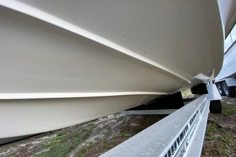 Slide: The Image of 2006 Mako 191 Inshore boat hull on trailer, side view. - 8