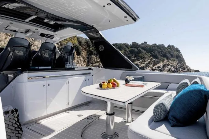 Slide: The Image of Luxurious 2026 Azimut Verve 42 yacht interior with elegant seating and scenic ocean view. - 18