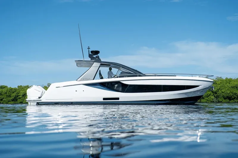 Slide: The Image of 2026 Azimut Verve 42 yacht on calm water under clear blue sky. - 2