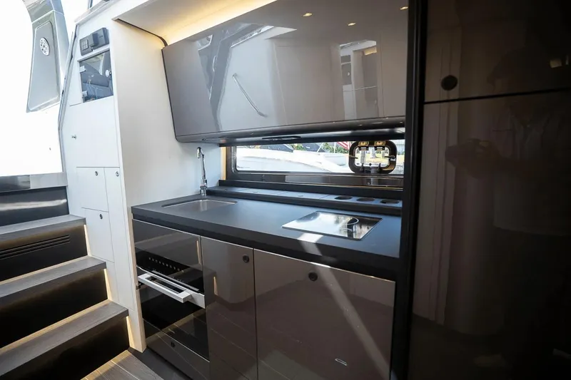Slide: The Image of Modern kitchen interior of 2026 Azimut Verve 42 yacht, featuring sleek cabinetry and appliances. - 25