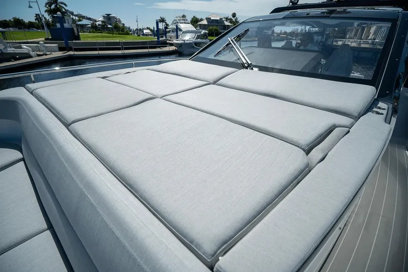 Slide: The Image of 2026 Azimut Verve 42 yacht with spacious sunbathing deck in marina setting. - 35