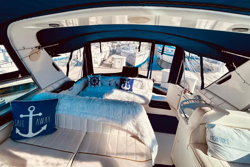 Slide: The Image of Luxurious 1999 Sea Ray Sundancer 330 interior with nautical-themed decor and plush seating. - 11