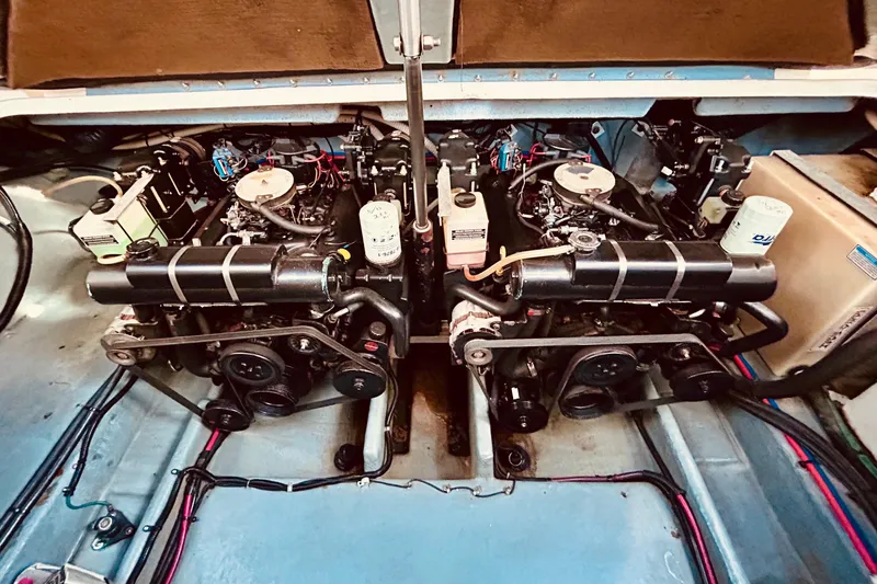Slide: The Image of Engine compartment of a 1999 Sea Ray Sundancer 330, showcasing dual engines and components. - 20