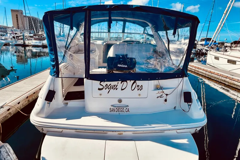 Slide: The Image of 1999 Sea Ray Sundancer 330 docked in San Diego marina, clear blue skies. - 9