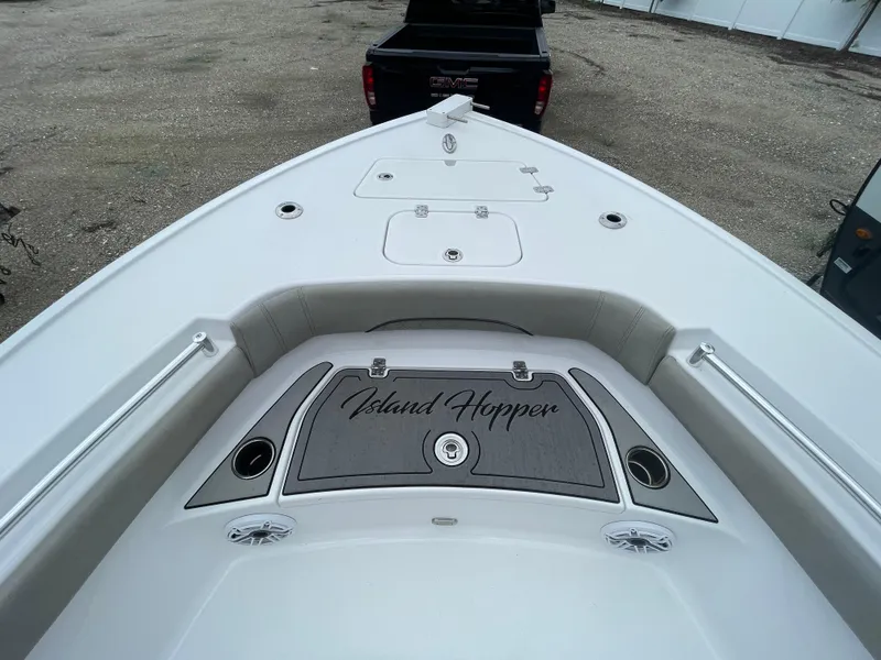 Slide: The Image of 2022 Sportsman Masters 247OE Bay Boat deck with "Island Hopper" mat. - 10