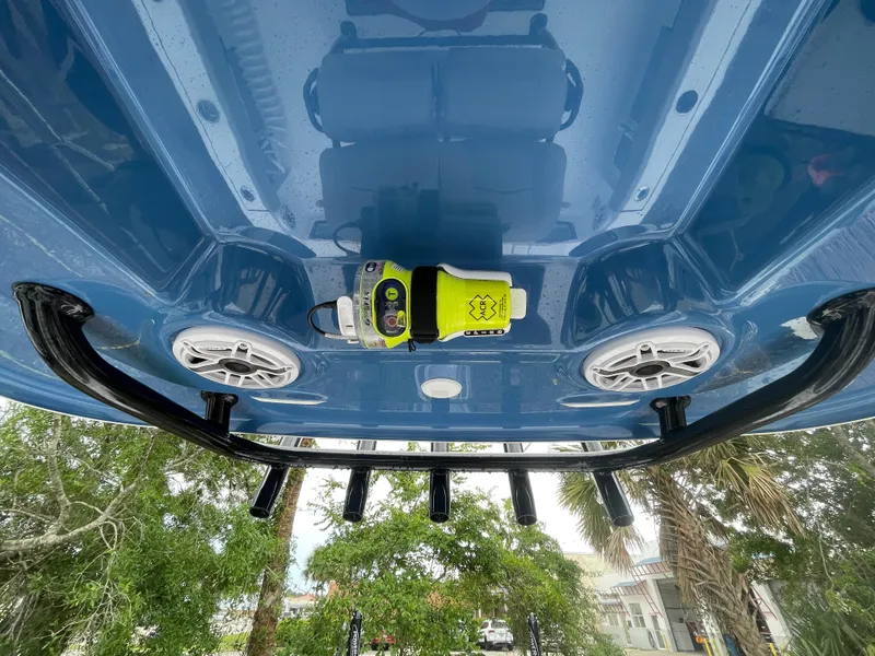 Slide: The Image of 2022 Sportsman Masters 247OE Bay Boat underside with speakers and equipment. - 13