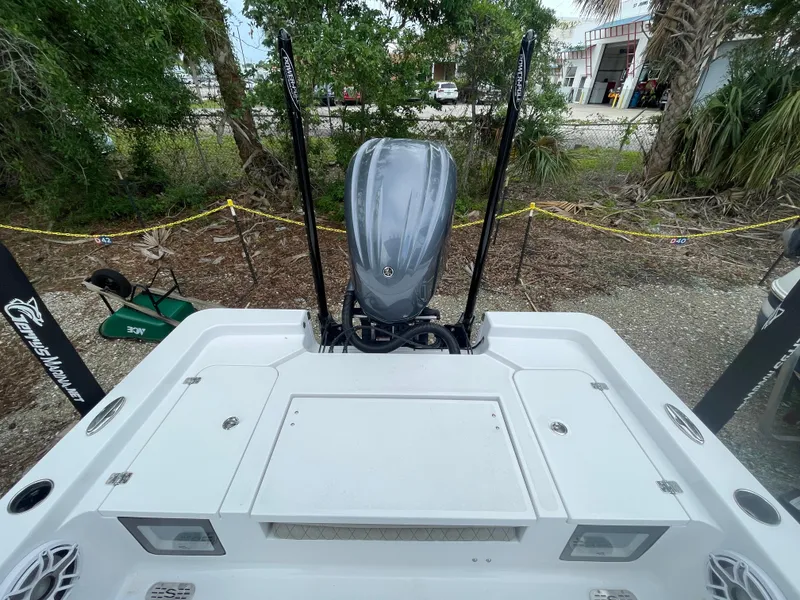 Slide: The Image of 2022 Sportsman Masters 247OE Bay Boat with outboard motor, viewed from the rear deck. - 16