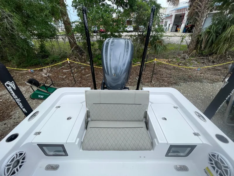 Slide: The Image of 2022 Sportsman Masters 247OE Bay Boat with seating and engine, parked outdoors. - 17