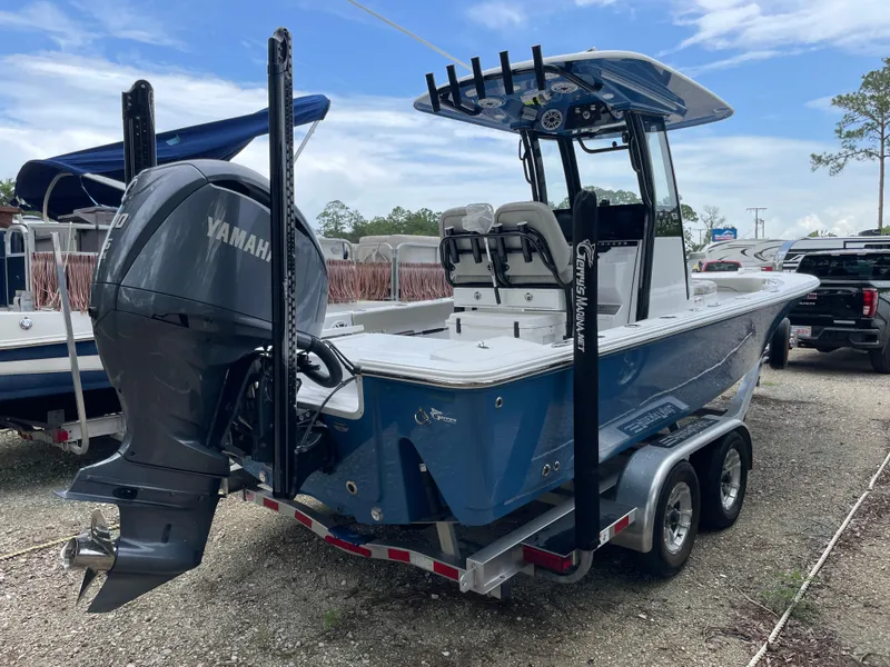Slide: The Image of 2022 Sportsman Masters 247OE Bay Boat on trailer, featuring Yamaha outboard motor. - 2